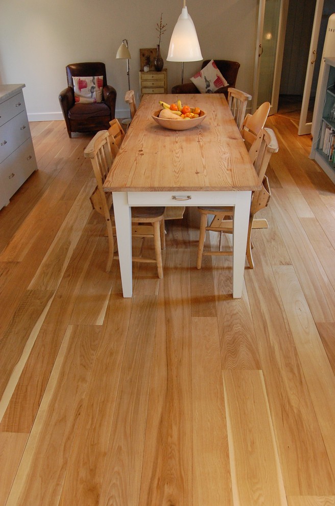 Kitchen/dining room combo - mid-sized eclectic light wood floor kitchen/dining room combo idea in Gloucestershire