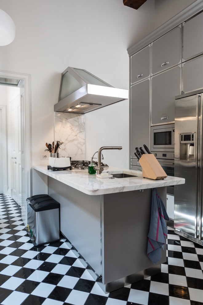 Contemporary galley kitchen in Florence with a submerged sink, flat-panel cabinets, grey cabinets, white splashback, stone slab splashback, stainless steel appliances, an island, marble worktops and ceramic flooring.