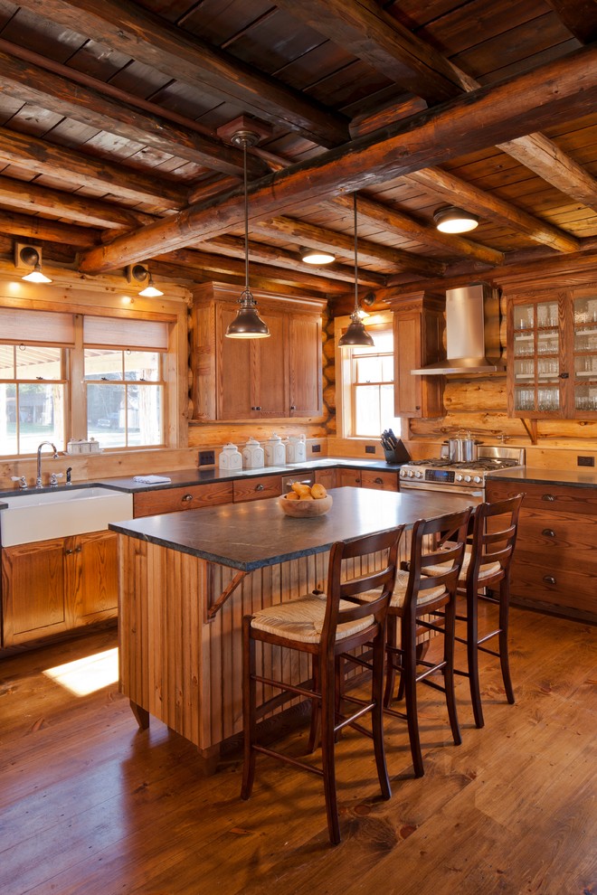 Kitchen - rustic kitchen idea in Portland Maine with a farmhouse sink, flat-panel cabinets and medium tone wood cabinets