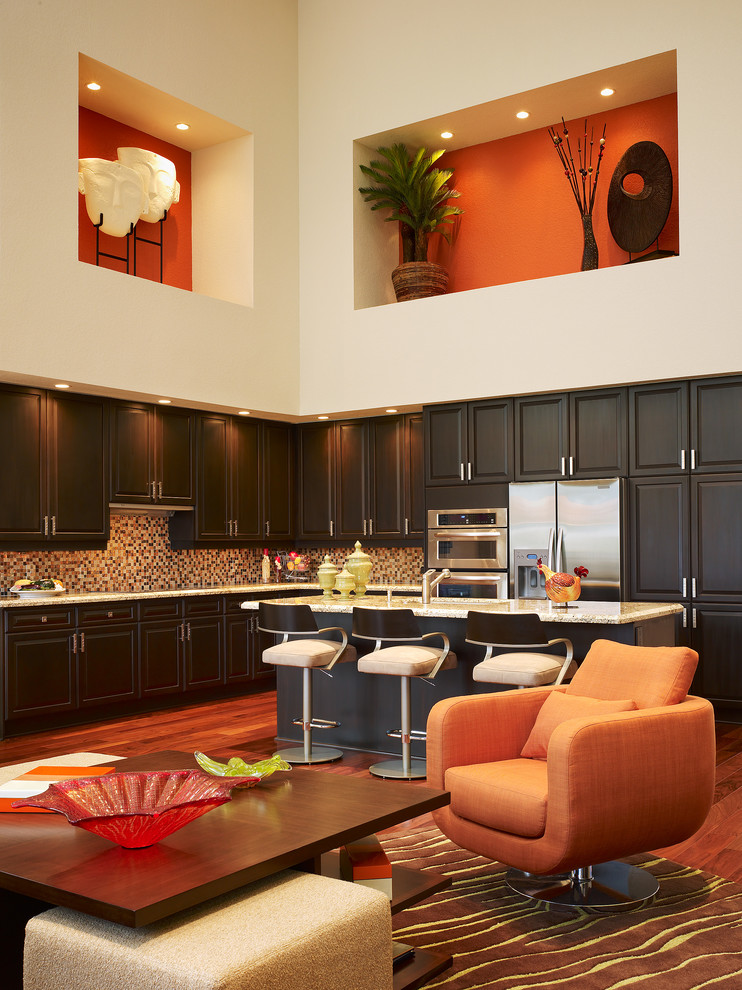 Trendy open concept kitchen photo in Miami with dark wood cabinets