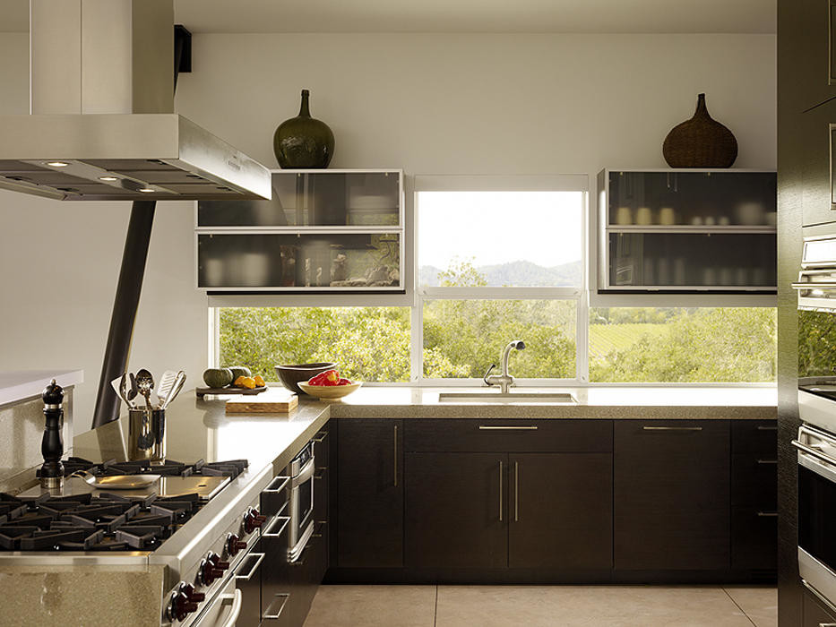 Photo of a medium sized world-inspired u-shaped kitchen in Vancouver with a single-bowl sink, flat-panel cabinets, dark wood cabinets, limestone worktops, window splashback, stainless steel appliances, concrete flooring, a breakfast bar and grey floors.