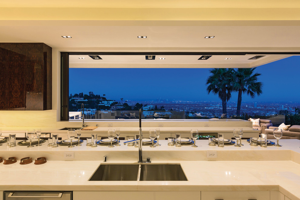 This is an example of a large contemporary kitchen in Los Angeles with an island.