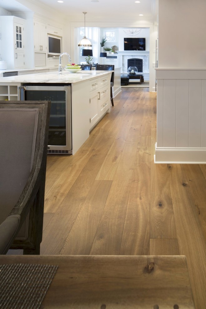 Design ideas for a traditional kitchen in Calgary with light hardwood flooring.