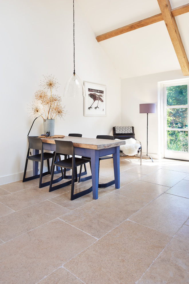 This is an example of a traditional kitchen in Wiltshire with limestone flooring.