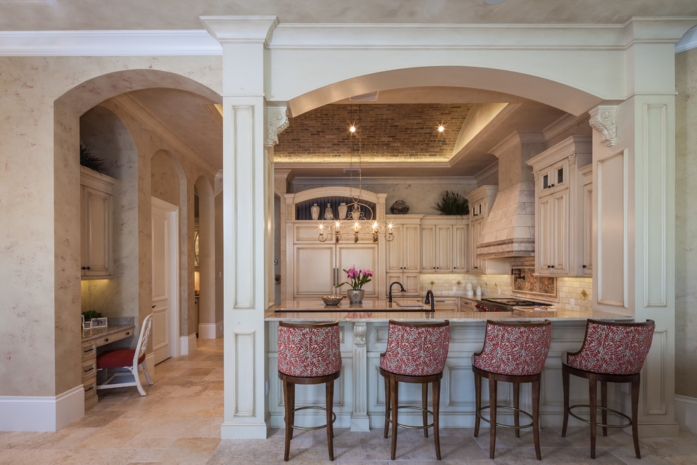 Inspiration for a timeless u-shaped kitchen remodel in Miami with raised-panel cabinets, beige cabinets, beige backsplash and beige countertops