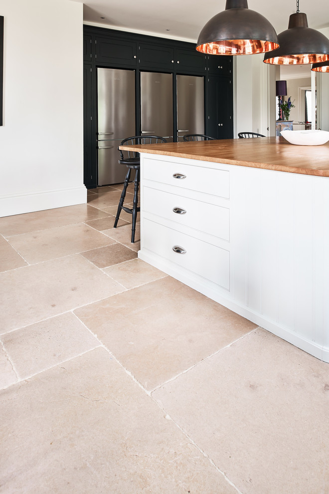 Design ideas for an eclectic kitchen in Wiltshire with limestone flooring.