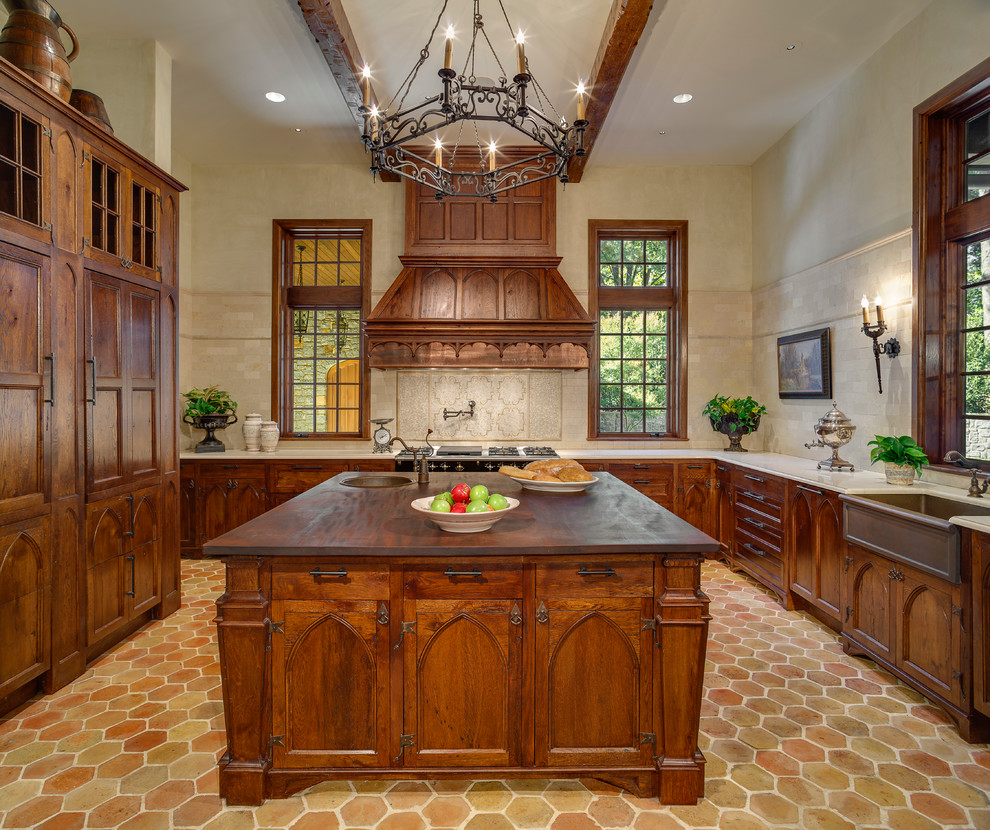 Kitchen - traditional kitchen idea in Other with a farmhouse sink, recessed-panel cabinets, marble countertops, beige backsplash and paneled appliances