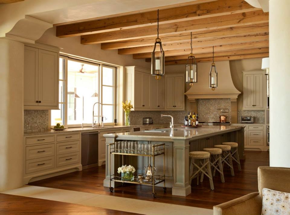 Example of a classic medium tone wood floor kitchen design in Austin with quartzite countertops, white backsplash and an island
