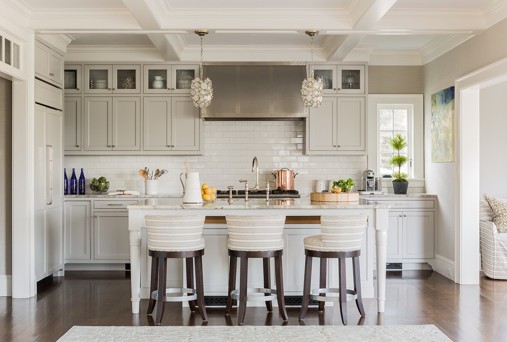 Inspiration for a mid-sized transitional galley dark wood floor open concept kitchen remodel in Boston with shaker cabinets, gray cabinets, marble countertops, white backsplash, subway tile backsplash, stainless steel appliances and an island