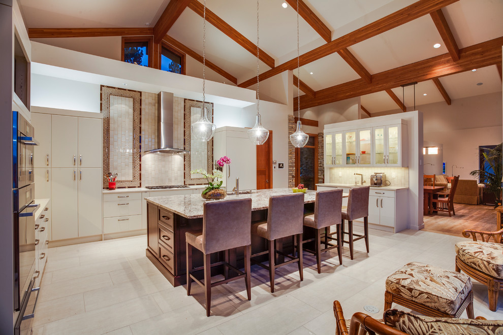 Immagine di una grande cucina design con ante lisce, ante bianche, elettrodomestici in acciaio inossidabile, pavimento con piastrelle in ceramica e paraspruzzi multicolore