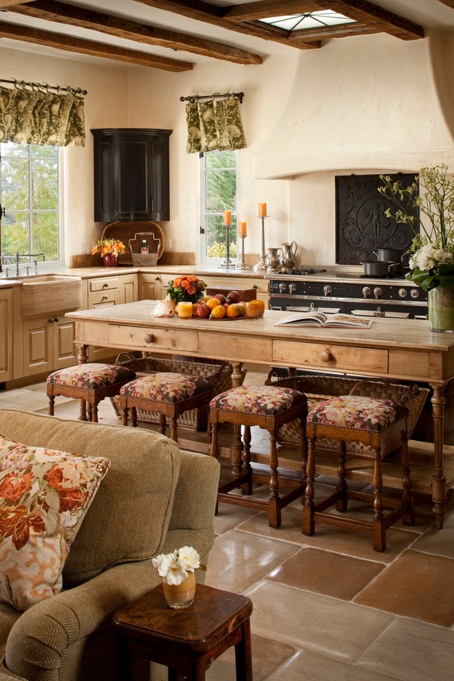 Large tuscan ceramic tile open concept kitchen photo in Other with a farmhouse sink, raised-panel cabinets, light wood cabinets, wood countertops, white backsplash, cement tile backsplash, stainless steel appliances and an island