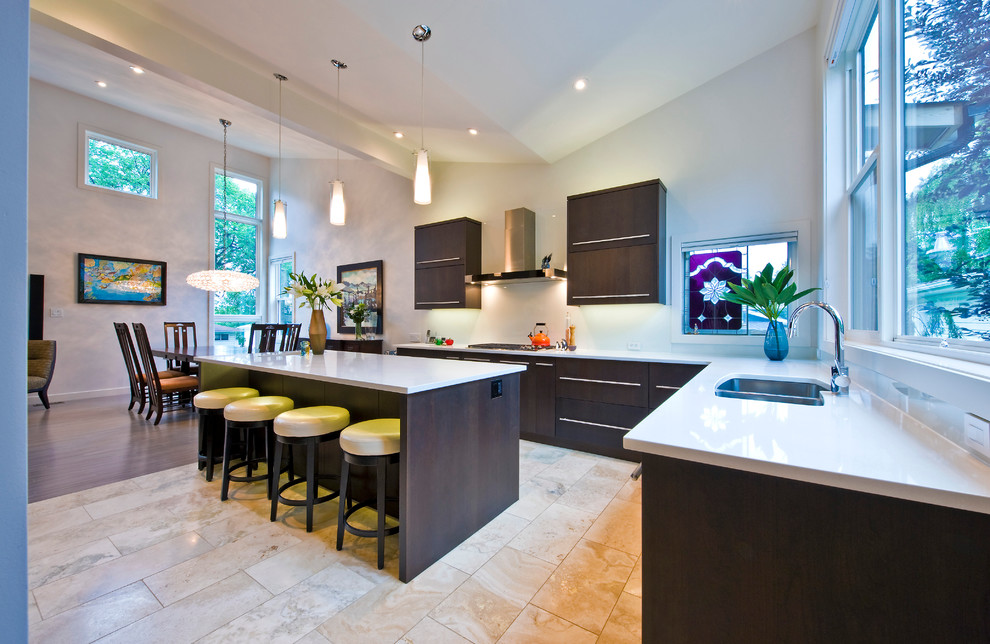 Esempio di una cucina abitabile contemporanea con lavello sottopiano, ante lisce, ante in legno bruno e elettrodomestici in acciaio inossidabile