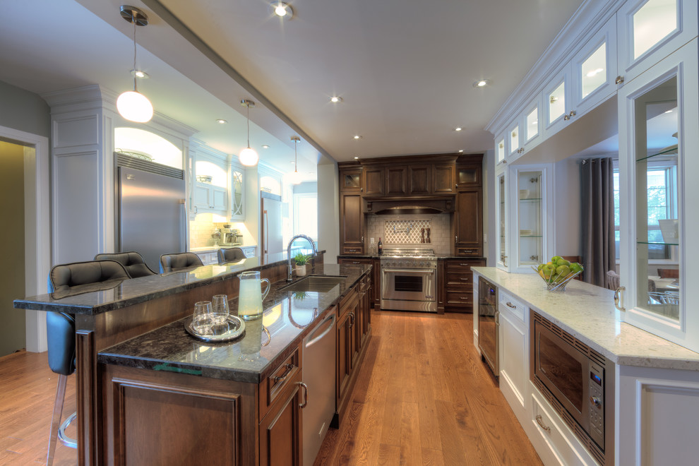 Example of a transitional kitchen design in Toronto