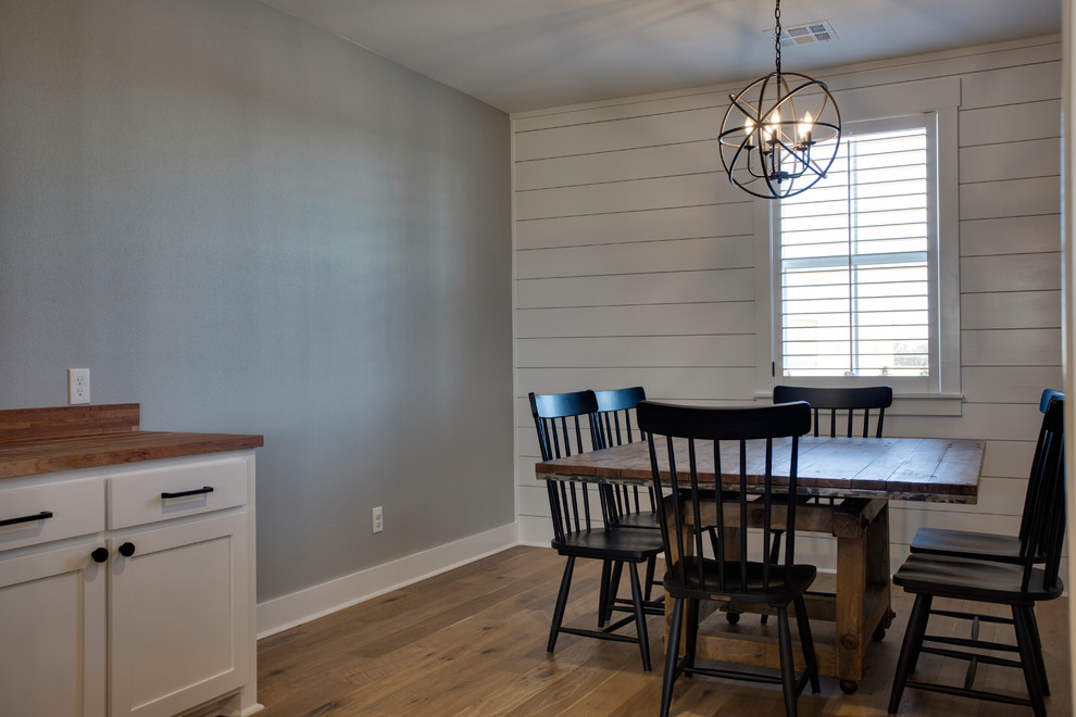 Example of a large farmhouse dining room design in Austin
