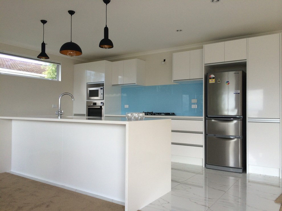 Photo of a large contemporary galley kitchen in Auckland.