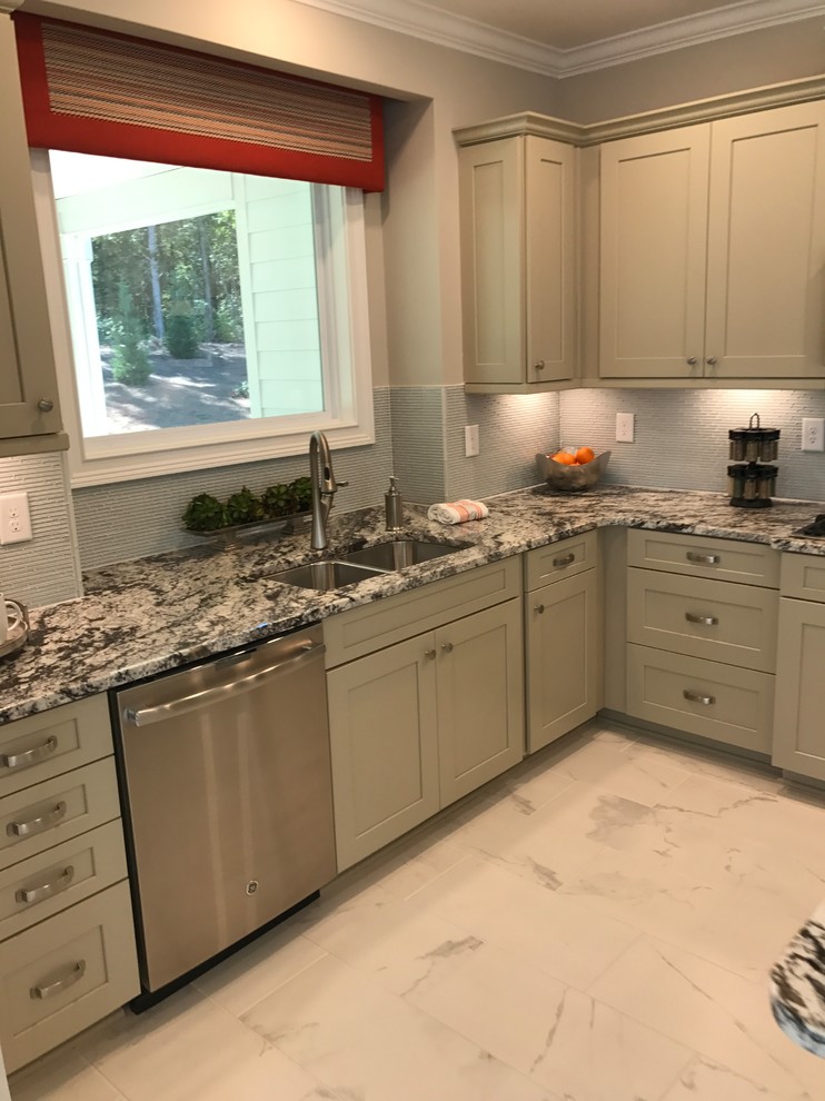 Kitchen - mid-sized transitional l-shaped porcelain tile and gray floor kitchen idea in Charlotte with an undermount sink, shaker cabinets, beige cabinets, granite countertops, gray backsplash, porcelain backsplash, stainless steel appliances and no island