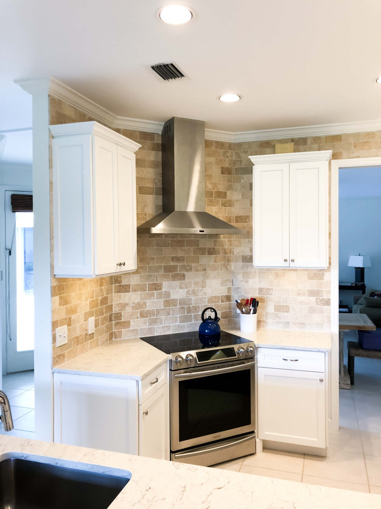 Example of a small minimalist u-shaped cement tile floor and white floor eat-in kitchen design in Salt Lake City with a single-bowl sink, shaker cabinets, white cabinets, marble countertops, brown backsplash, brick backsplash, stainless steel appliances and white countertops