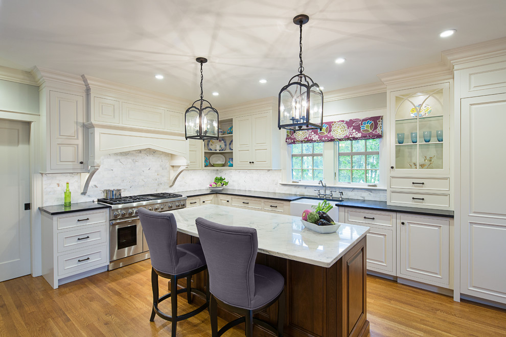 Enclosed kitchen - large traditional l-shaped dark wood floor enclosed kitchen idea in New York with a farmhouse sink, beaded inset cabinets, white cabinets, granite countertops, multicolored backsplash, subway tile backsplash, paneled appliances and an island
