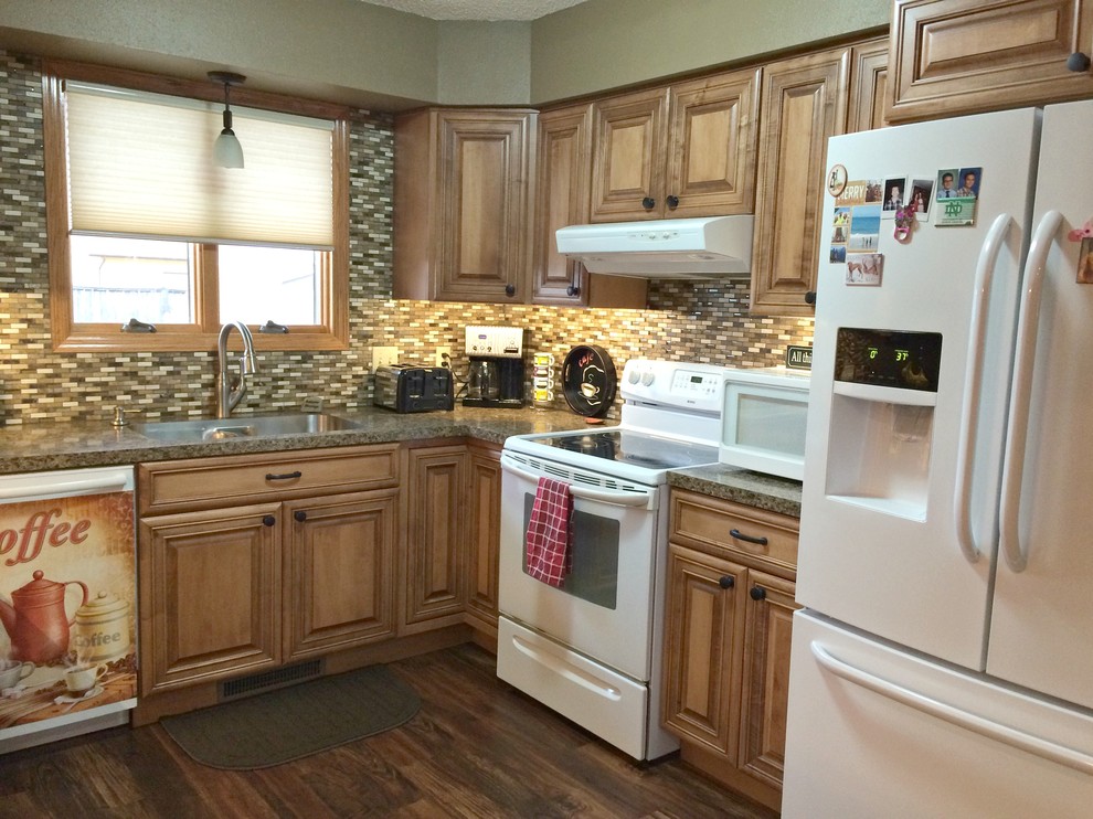 Eat-in kitchen - mid-sized traditional u-shaped dark wood floor eat-in kitchen idea in Other with a double-bowl sink, raised-panel cabinets, light wood cabinets, laminate countertops, multicolored backsplash, mosaic tile backsplash, white appliances and a peninsula