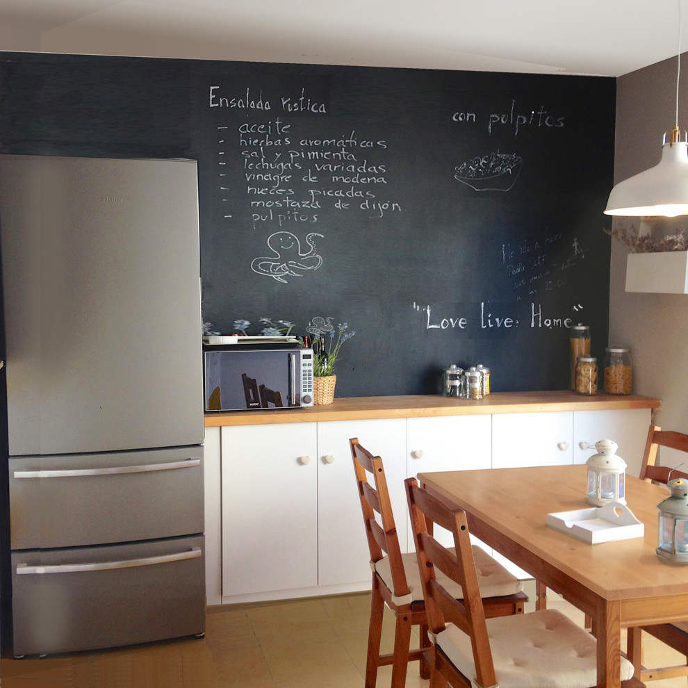 Example of a transitional kitchen design in Madrid