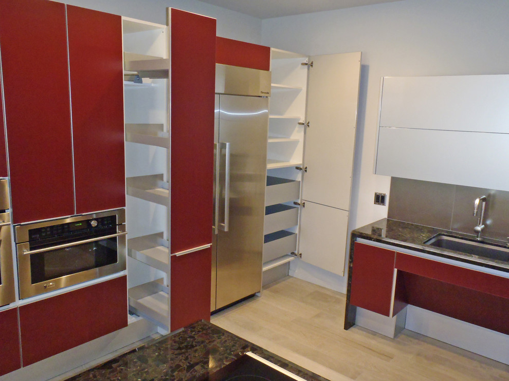 This is an example of a contemporary l-shaped kitchen/diner in Hawaii with a submerged sink, flat-panel cabinets, red cabinets, marble worktops, metallic splashback, porcelain splashback and stainless steel appliances.