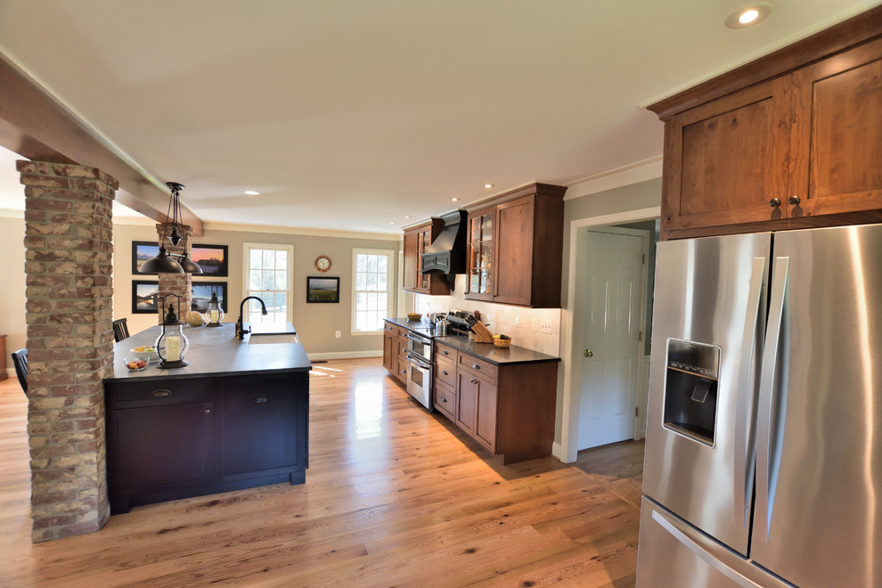 Example of a large cottage galley open concept kitchen design in DC Metro with flat-panel cabinets, medium tone wood cabinets, soapstone countertops and an island