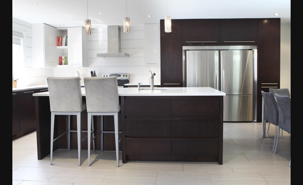 This is an example of a medium sized modern l-shaped kitchen/diner in Montreal with a submerged sink, flat-panel cabinets, dark wood cabinets, engineered stone countertops, white splashback, ceramic splashback, stainless steel appliances, porcelain flooring and an island.