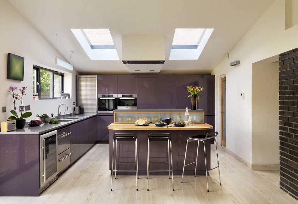 Trendy open concept kitchen photo in Surrey with flat-panel cabinets, purple cabinets, solid surface countertops, stainless steel appliances and a peninsula