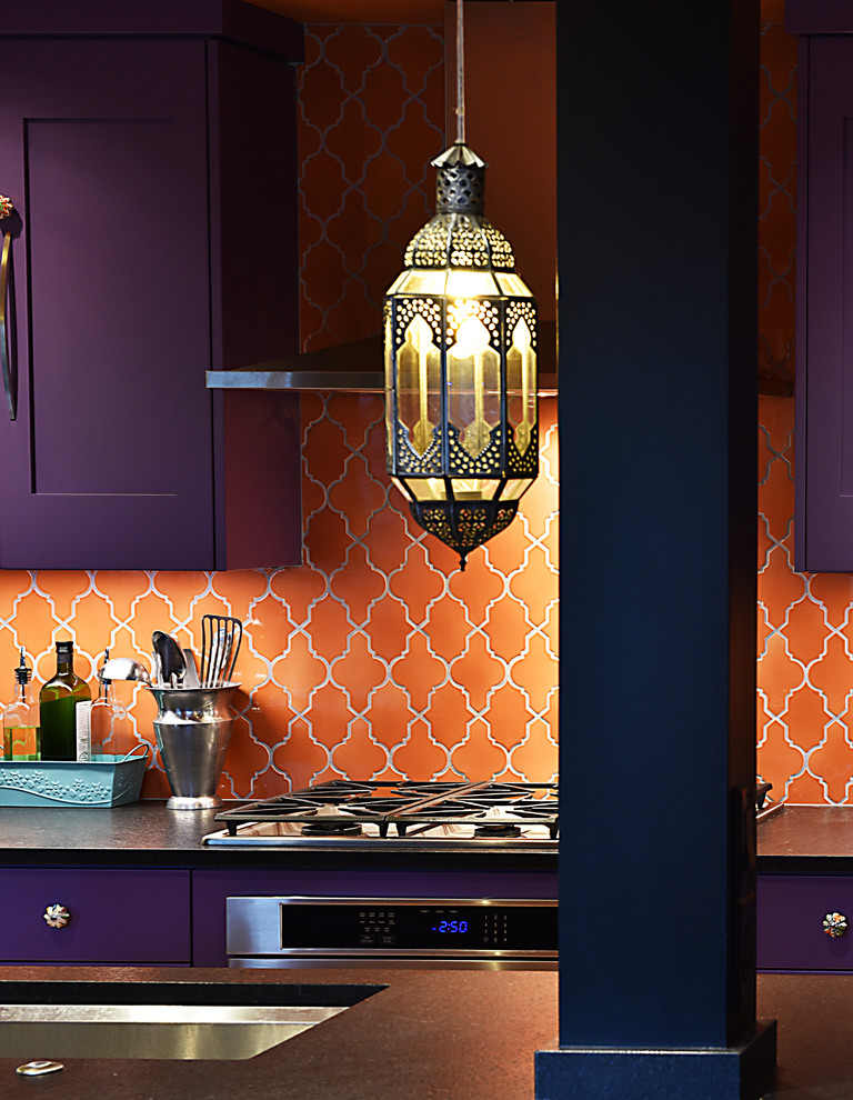 Design ideas for a large bohemian galley kitchen/diner in Portland with a submerged sink, shaker cabinets, purple cabinets, composite countertops, orange splashback, ceramic splashback, stainless steel appliances, light hardwood flooring and an island.
