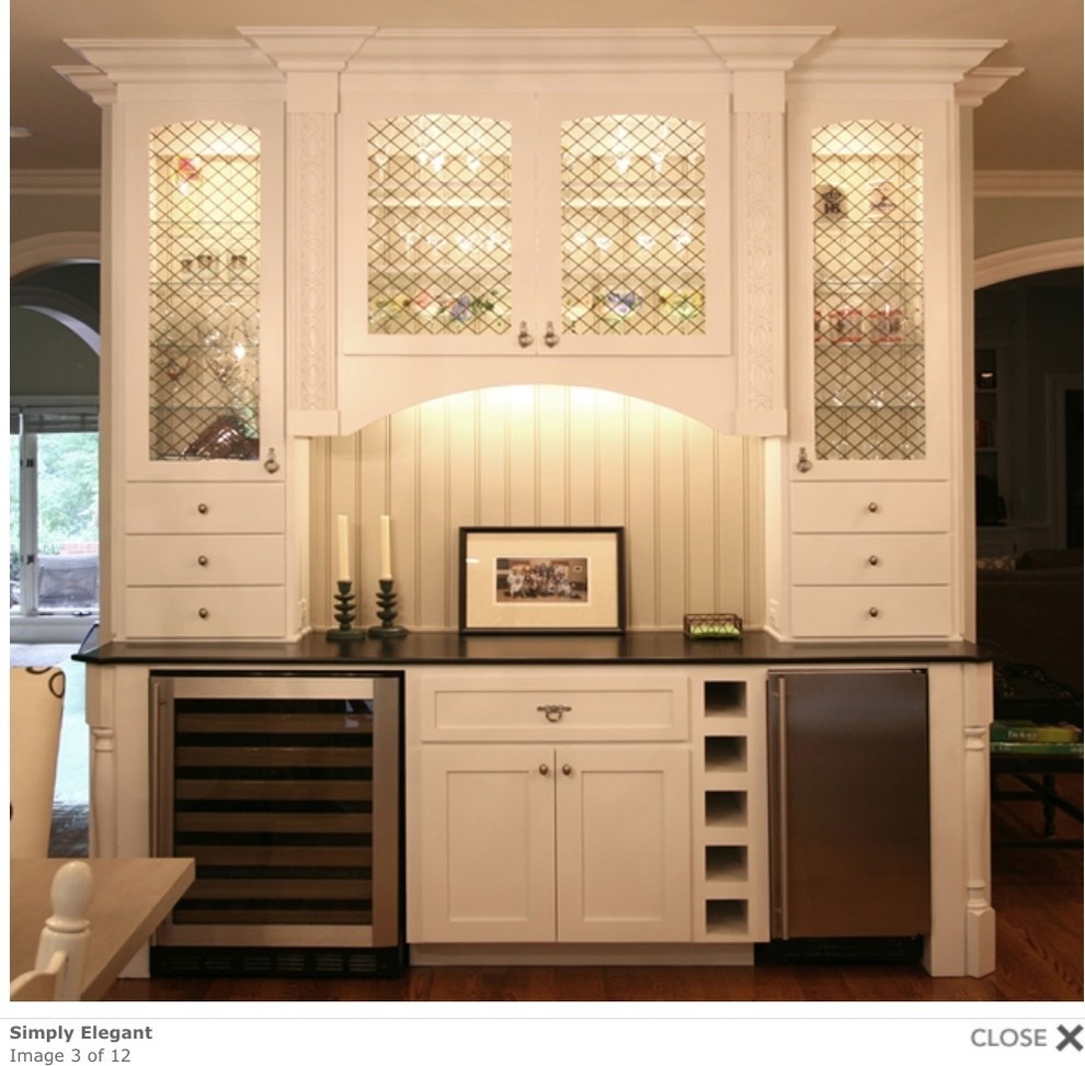 Eat-in kitchen - large transitional medium tone wood floor eat-in kitchen idea in Charlotte with white cabinets and shaker cabinets