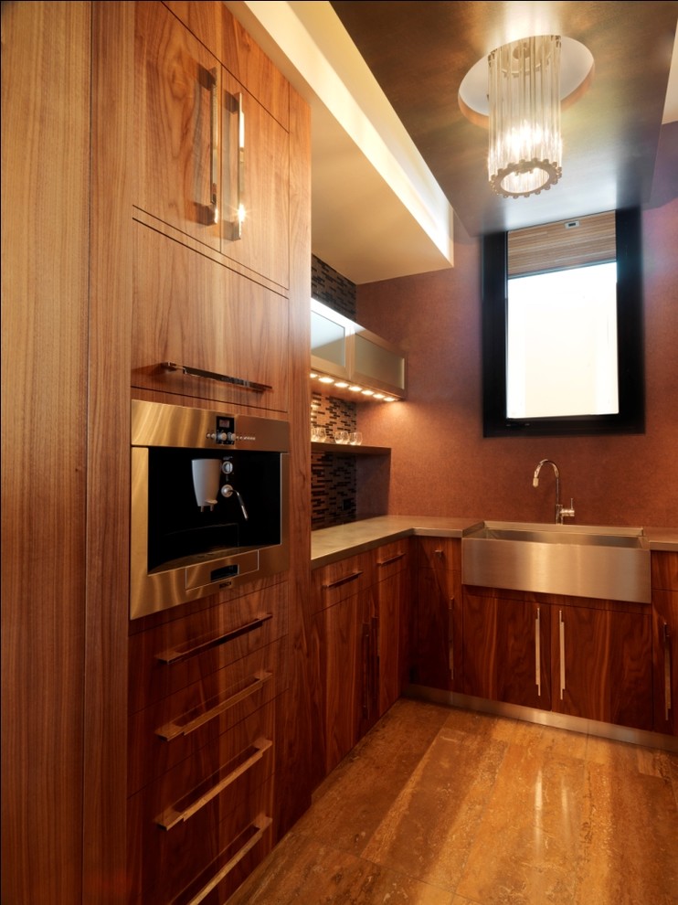 Photo of a rustic kitchen in Burlington with stainless steel appliances, a belfast sink, stainless steel worktops, flat-panel cabinets and dark wood cabinets.