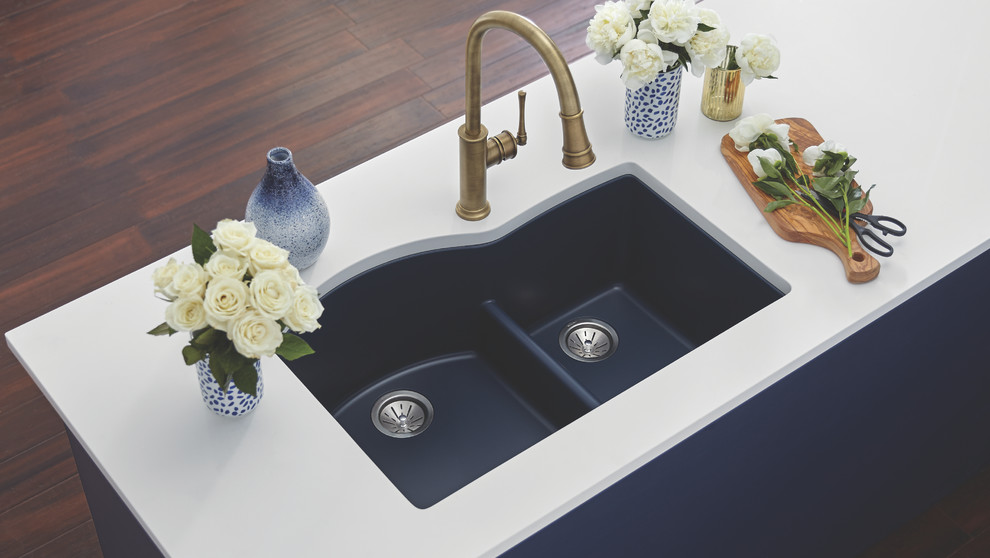 Inspiration for a kitchen remodel in Chicago with a double-bowl sink, blue cabinets and white countertops