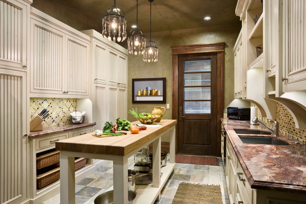 Example of a mountain style kitchen design in Other with a double-bowl sink, recessed-panel cabinets, beige cabinets, wood countertops and beige backsplash