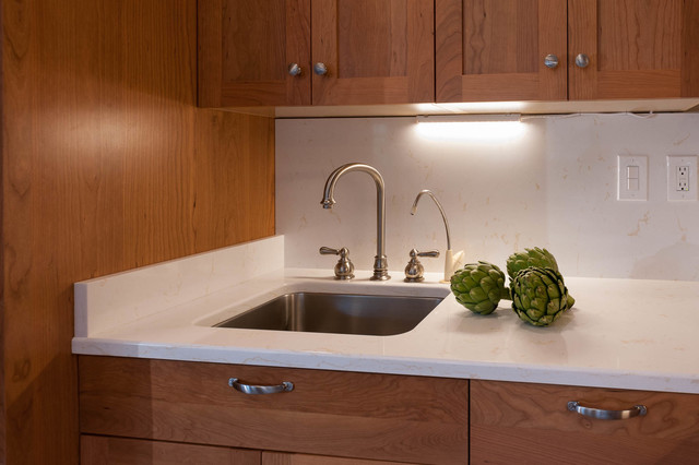 Custom, in-cabinet dish drying rack. Water drips directly into the sink. -  Transitional - Kitchen - Seattle - by Genay Bell Interior Design