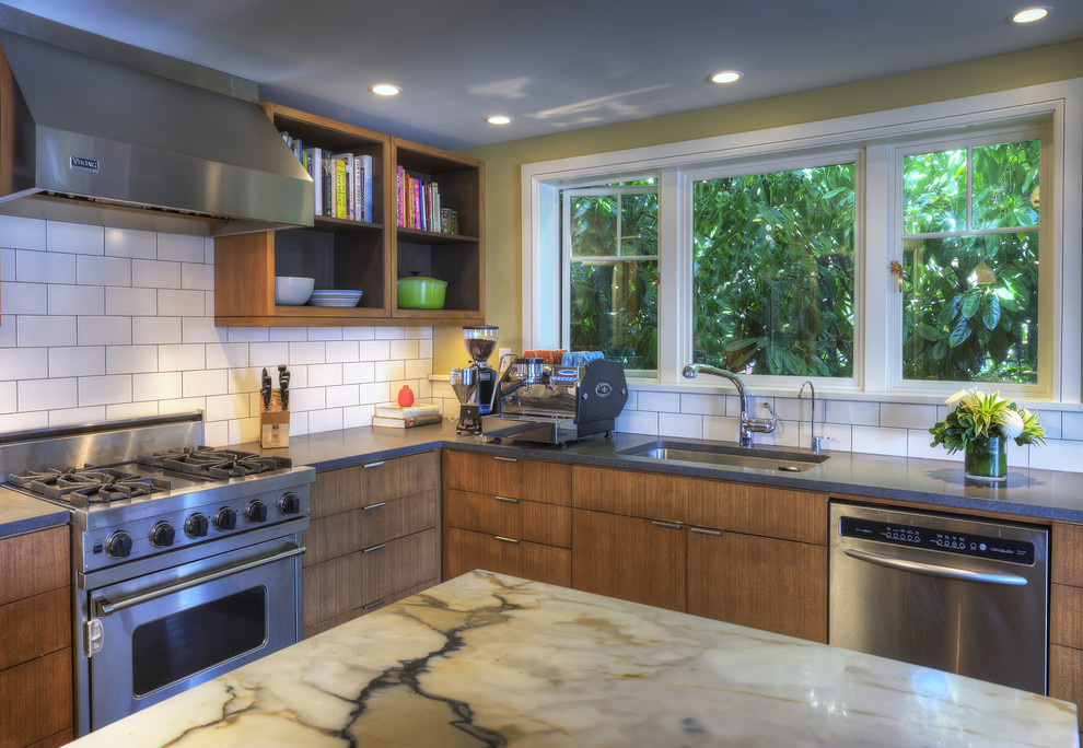 1950s dark wood floor kitchen photo in Seattle with a single-bowl sink, flat-panel cabinets, dark wood cabinets, marble countertops, white backsplash, ceramic backsplash and stainless steel appliances
