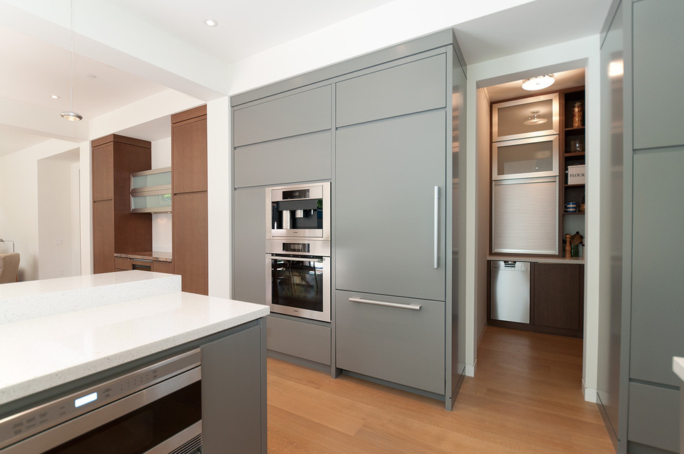 Contemporary kitchen in Vancouver with integrated appliances.