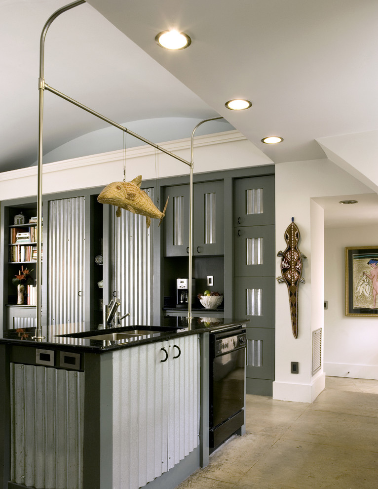 Eat-in kitchen - mid-sized industrial galley concrete floor eat-in kitchen idea in Atlanta with a double-bowl sink, black appliances, stainless steel cabinets, granite countertops and an island