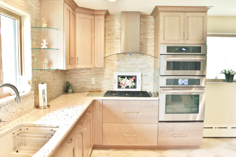 Example of a mid-sized transitional u-shaped eat-in kitchen design in Philadelphia with an undermount sink, shaker cabinets, light wood cabinets, quartz countertops, beige backsplash, mosaic tile backsplash, stainless steel appliances and no island