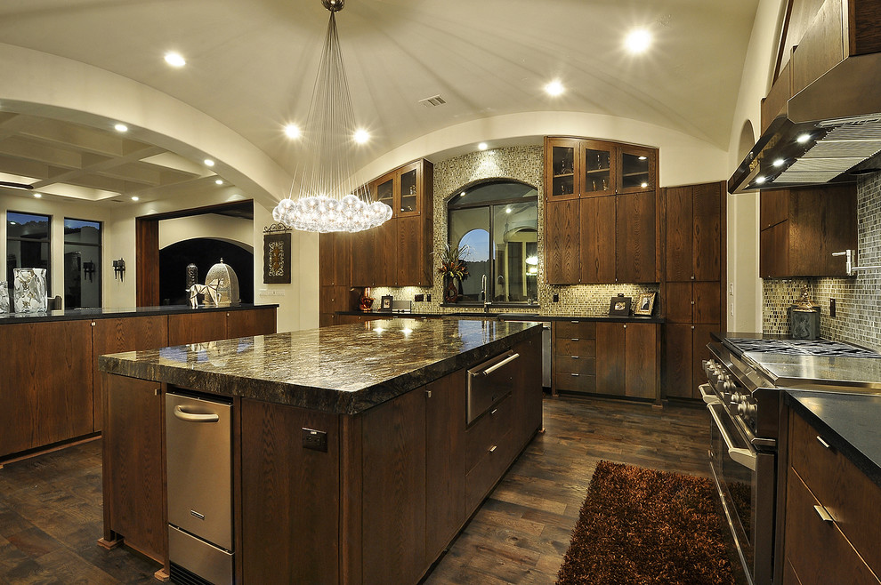 Tuscan kitchen photo in Austin with mosaic tile backsplash, stainless steel appliances, brown backsplash, dark wood cabinets and flat-panel cabinets