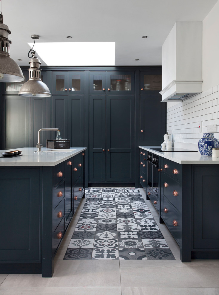 Classic kitchen in Other with a built-in sink, shaker cabinets, blue cabinets, quartz worktops, white splashback, ceramic splashback, stainless steel appliances, ceramic flooring and an island.
