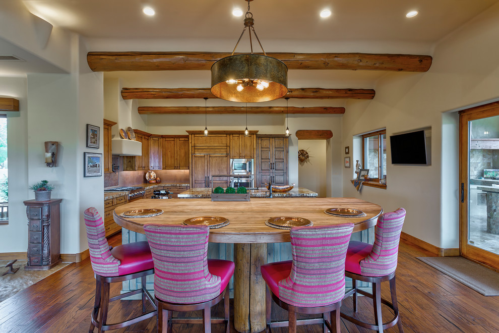 Large southwest medium tone wood floor and brown floor eat-in kitchen photo in Phoenix with a drop-in sink, recessed-panel cabinets, medium tone wood cabinets, wood countertops, metallic backsplash, stone slab backsplash, stainless steel appliances, two islands and brown countertops