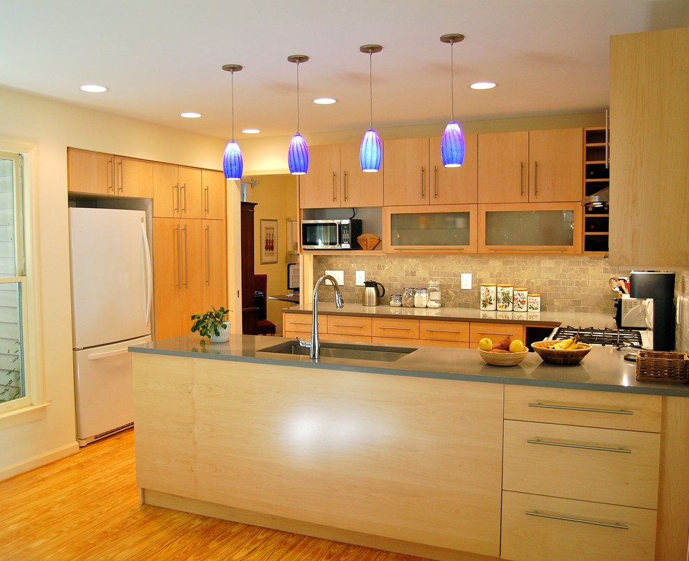 Inspiration for a mid-sized modern u-shaped light wood floor kitchen pantry remodel in Raleigh with an undermount sink, flat-panel cabinets, light wood cabinets, quartz countertops, gray backsplash, stone tile backsplash, white appliances and a peninsula