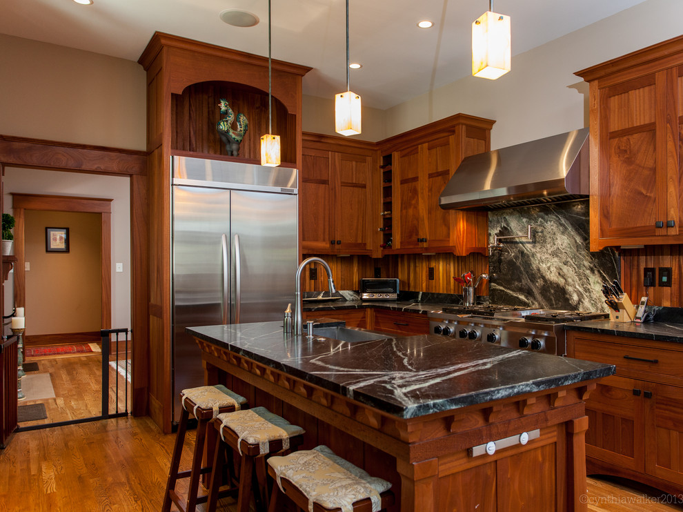 Photo of an arts and crafts kitchen in Other with stainless steel appliances.