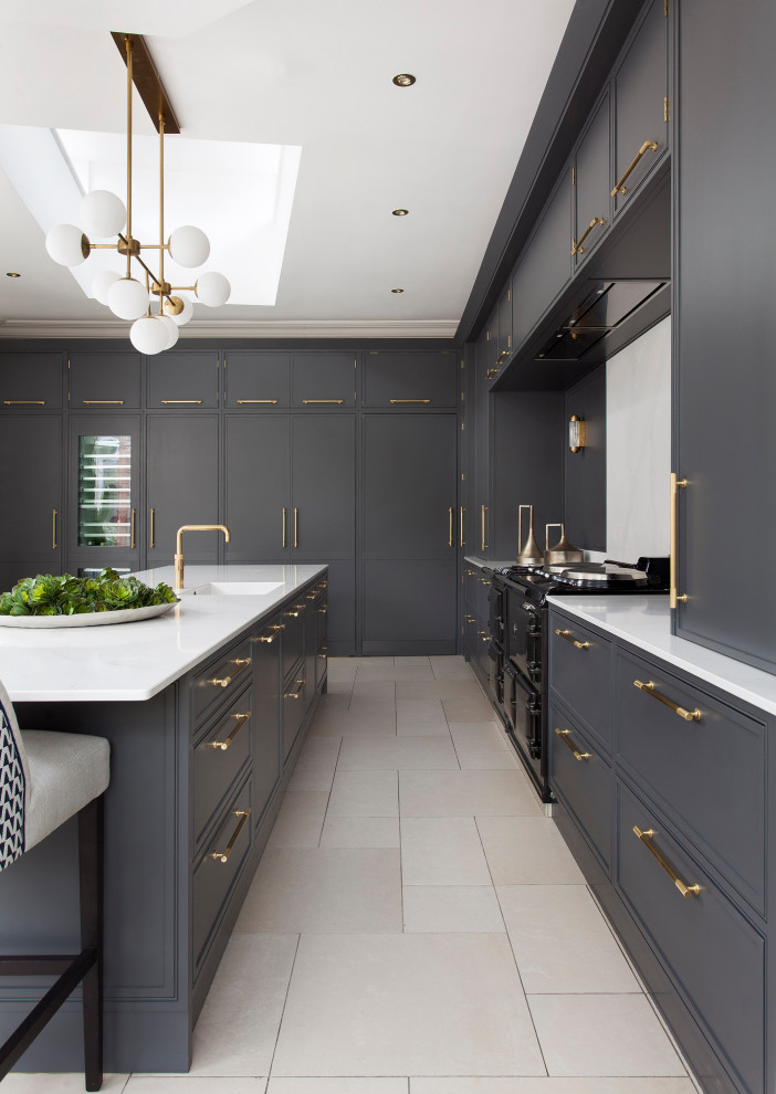 This is an example of a large urban l-shaped kitchen/diner in Dublin with a single-bowl sink, shaker cabinets, grey cabinets, quartz worktops, white splashback, stone slab splashback, black appliances, ceramic flooring, an island, white floors and white worktops.