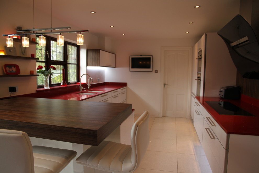 Medium sized contemporary kitchen in Cardiff with an island.