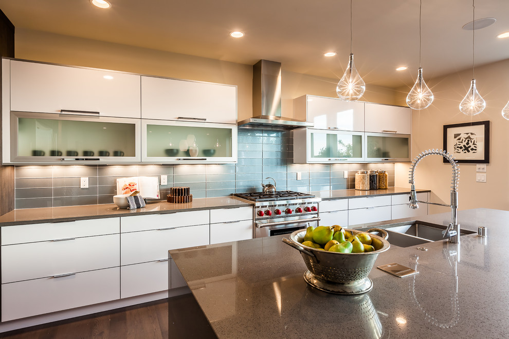This is an example of a contemporary kitchen in Seattle with flat-panel cabinets.