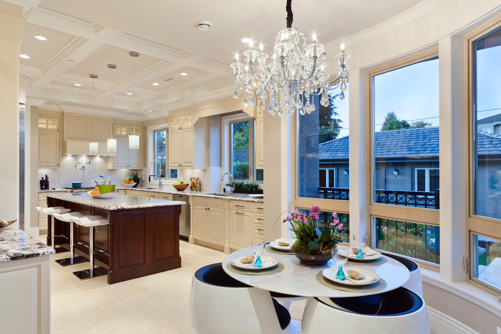 Contemporary kitchen/diner in Vancouver with a submerged sink, raised-panel cabinets and beige cabinets.