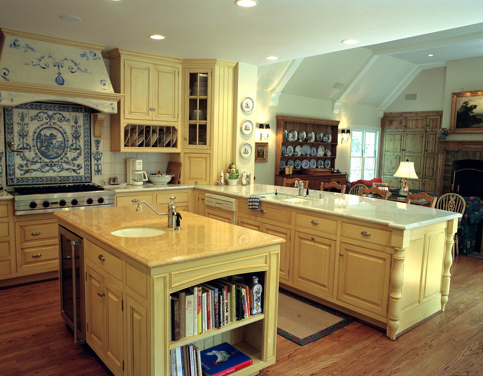 Design ideas for a rustic kitchen in Los Angeles with yellow cabinets, beaded cabinets and blue splashback.