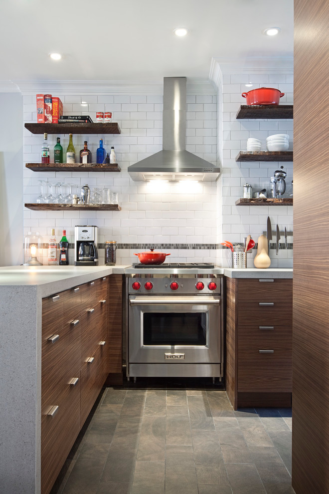 This is an example of a medium sized traditional l-shaped enclosed kitchen in New York with a built-in sink, white cabinets, white splashback, white appliances, dark hardwood flooring and an island.