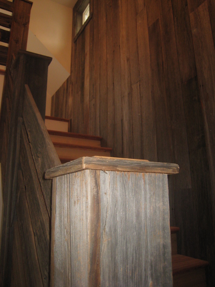 Rustic wood staircase in Boston with wood risers.